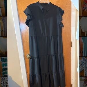Woman’s black midi dress
